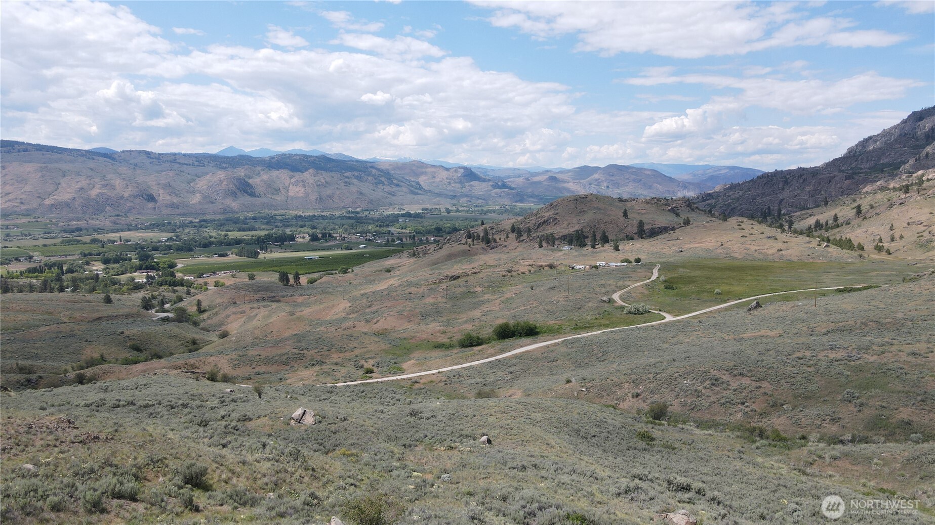 -lot B Swanson Mill Road Oroville, WA 98844 - Photo 1 of 13 a view of a dry yard with mountains in the background