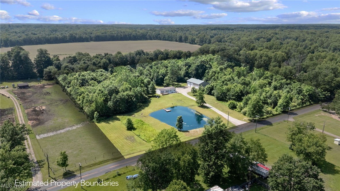 1467 Notman Road Deerfield, OH 44411 - Photo 35 of 37 Aerial view of property's location with a forest and a large body of water