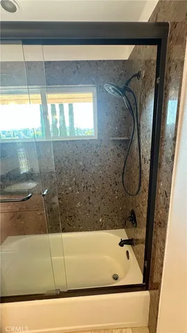 a view of a two chairs in the balcony