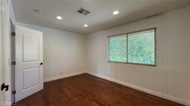 a view of a house with pool and sitting area