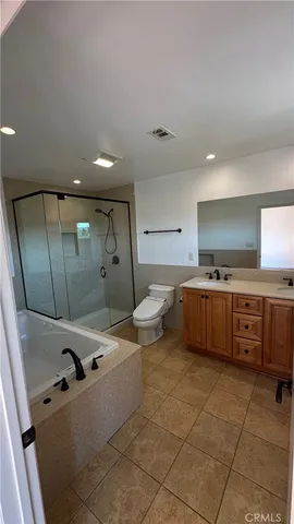 an entryway in front of a house with wooden floor