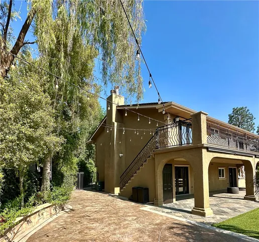a view of a chairs and fire pit in the yard