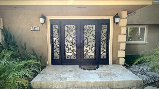 a view of an empty room with windows