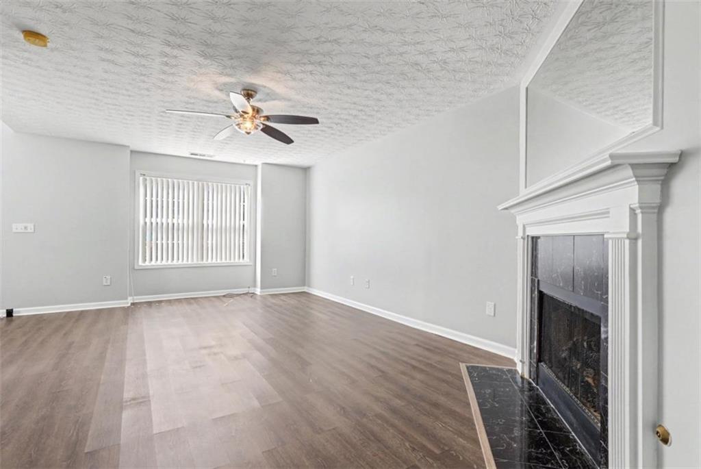 4612 Grand Central Parkway Decatur, GA 30035 - Photo 3 of 10 wooden floor in an empty room with a window