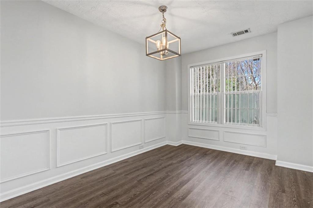 4612 Grand Central Parkway Decatur, GA 30035 - Photo 4 of 10 a view of empty room with wooden floor and fan