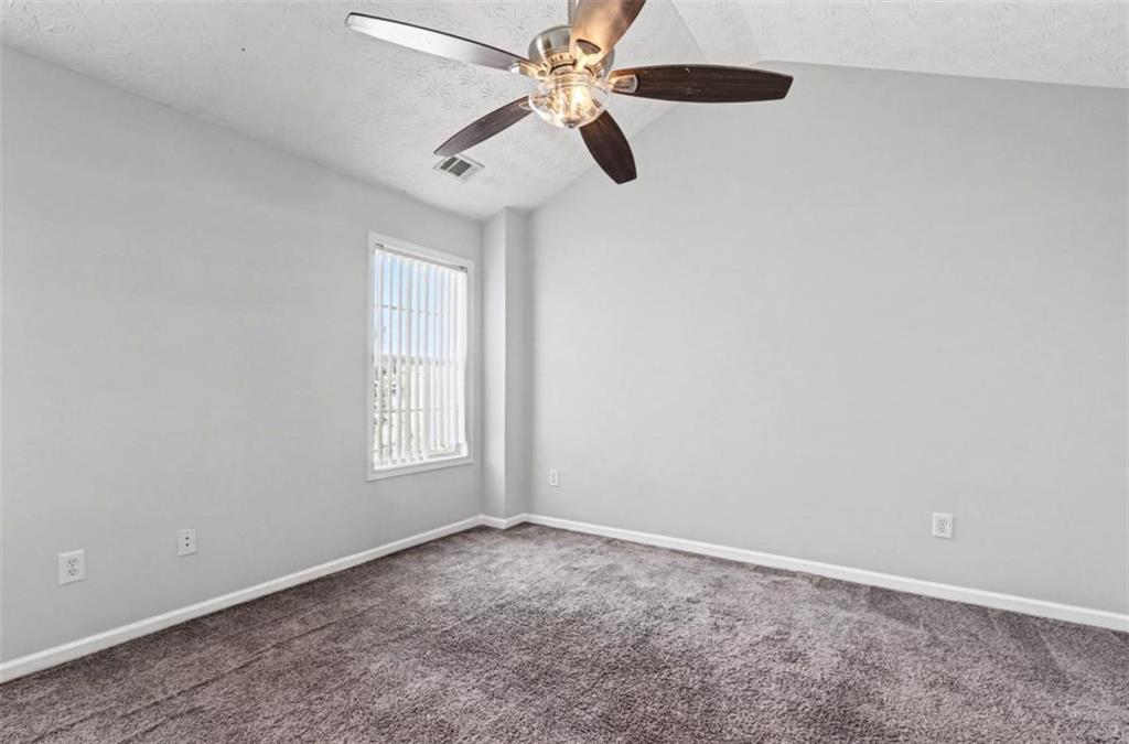 4612 Grand Central Parkway Decatur, GA 30035 - Photo 7 of 10 an empty room with closet and windows