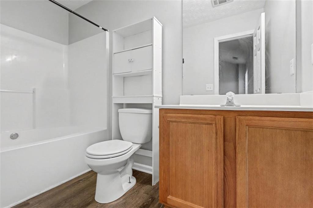 4612 Grand Central Parkway Decatur, GA 30035 - Photo 9 of 10 a bathroom with a sink toilet and shower