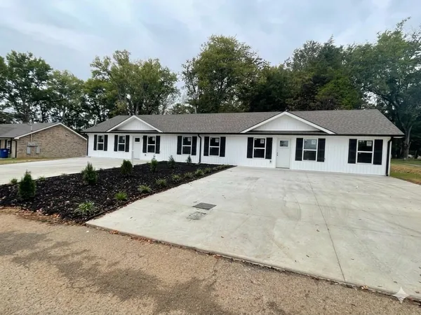 front view of a house with a yard