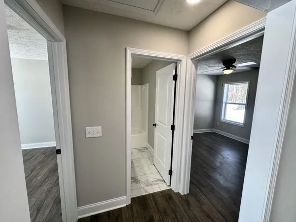 wooden floor in a hall with an entryway door