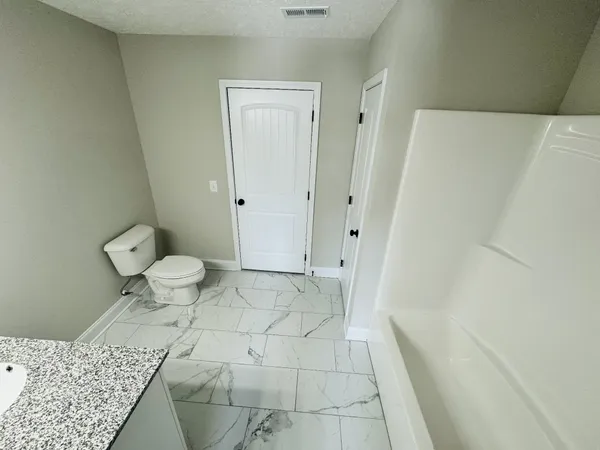a bathroom with a sink and a toilet