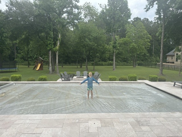 30702 Spring Lake Boulevard Tomball, TX 77375 - Photo 45 of 49 Pool has automatic retractable cover (very strong)