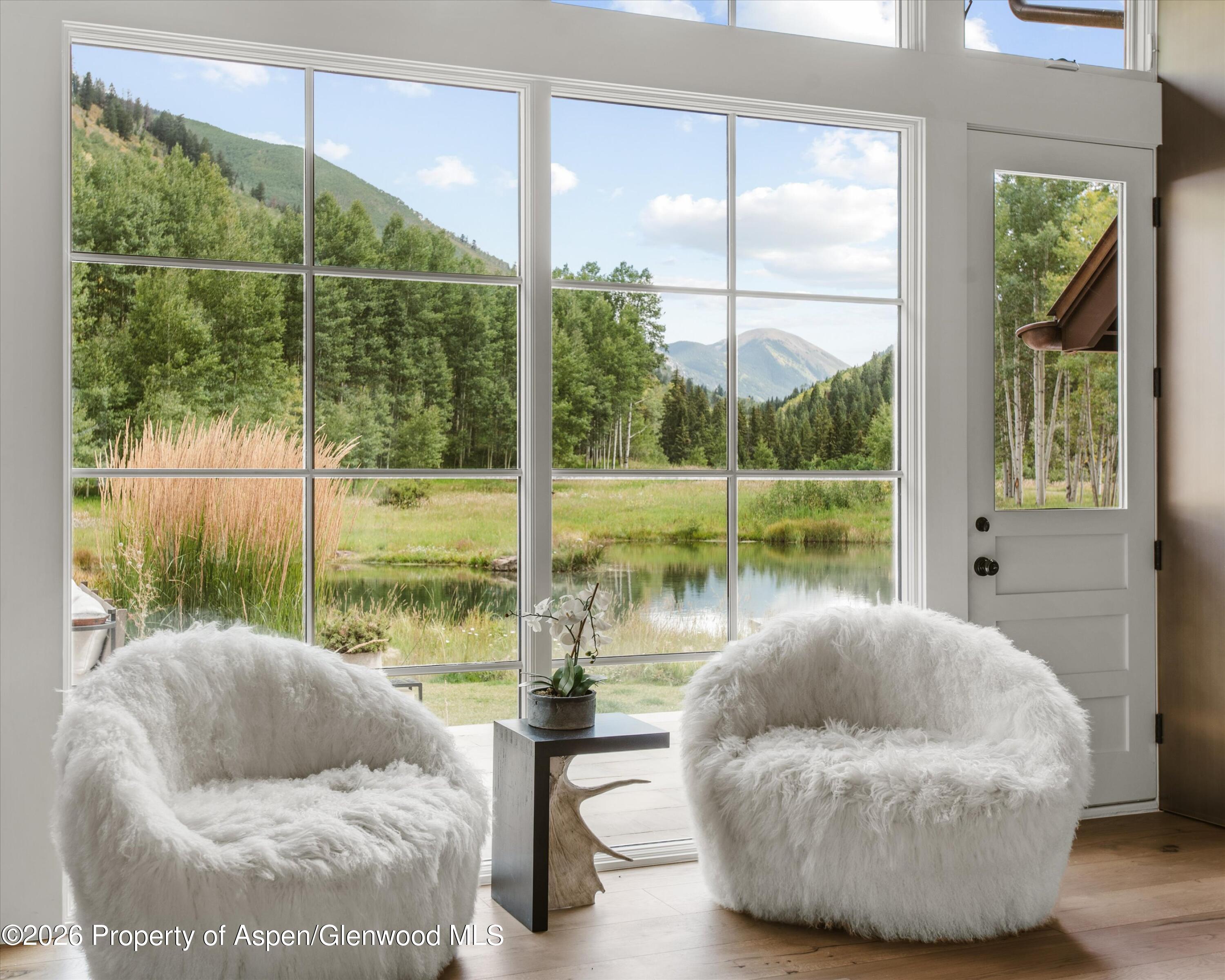 5387 Castle Creek Road Aspen, CO 81612 - Photo 7 of 25 a living room with couch and a large window