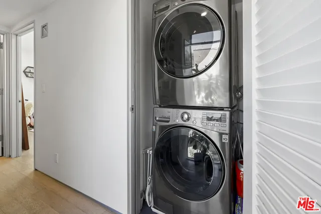 a view of a hallway with washer and dryer