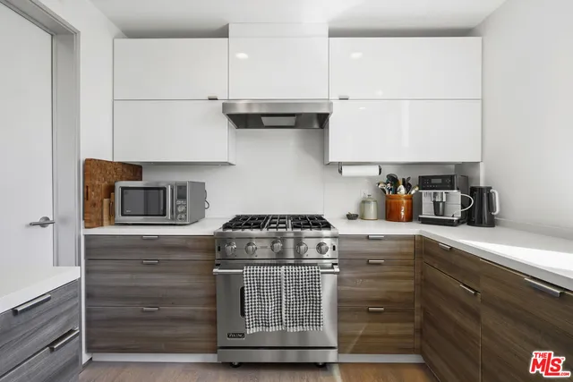 a kitchen with a stove and cabinets