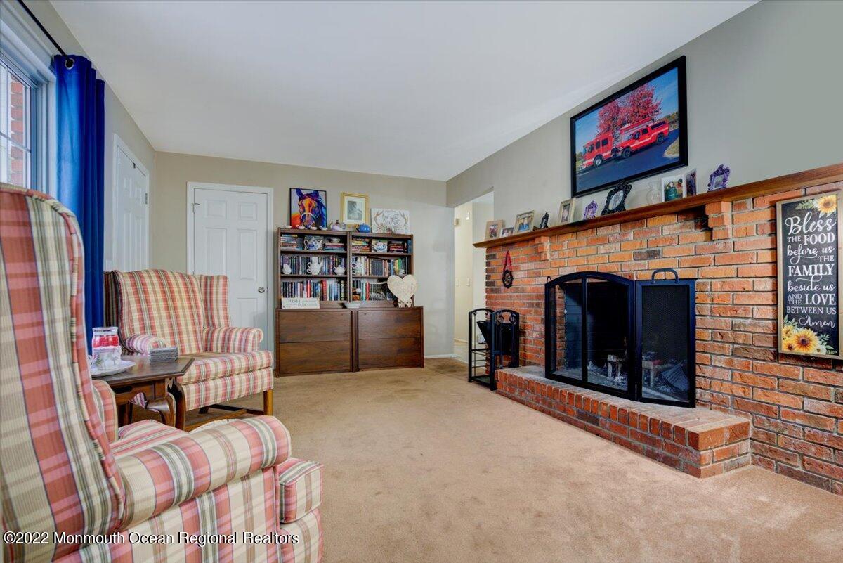 914 Monmouth Road Cream Ridge, NJ 08514 - Photo 14 of 17 a living room with furniture and a fireplace