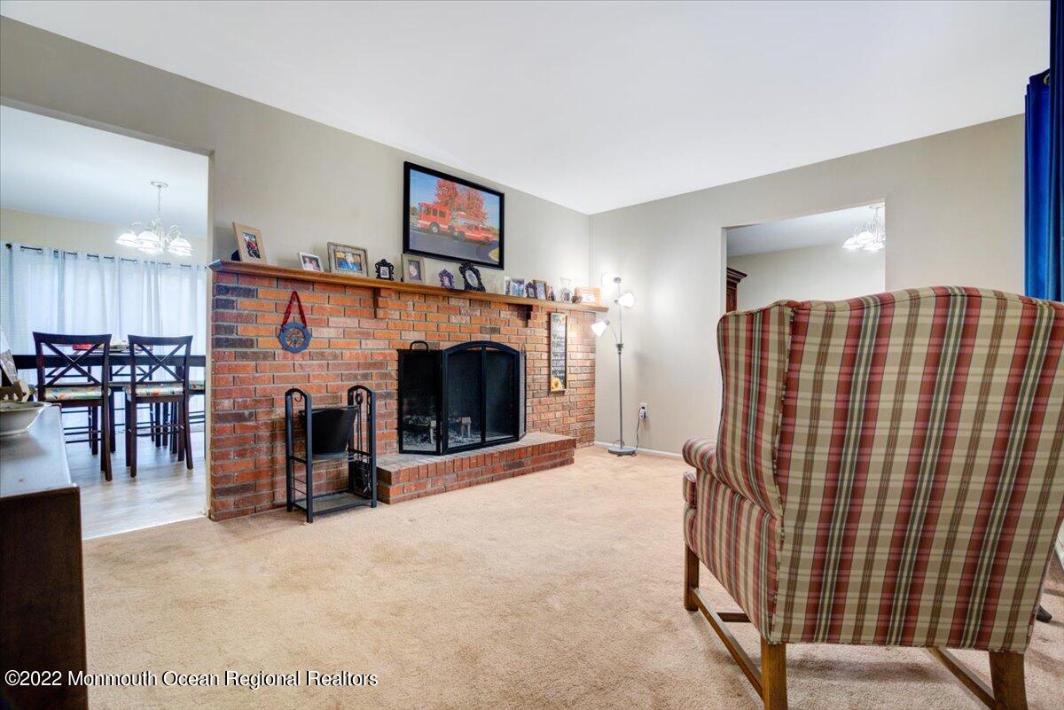 914 Monmouth Road Cream Ridge, NJ 08514 - Photo 15 of 17 a view of livingroom with fireplace and window