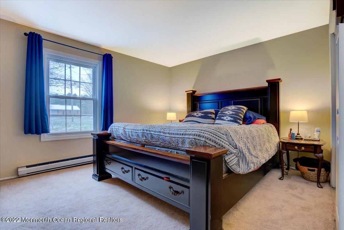 914 Monmouth Road Cream Ridge, NJ 08514 - Photo 5 of 17 a bedroom with a bed and a window