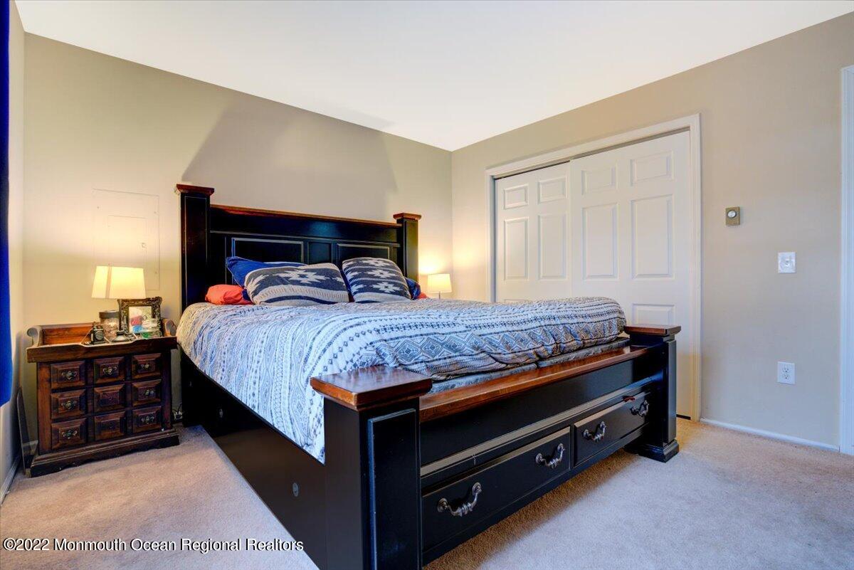 914 Monmouth Road Cream Ridge, NJ 08514 - Photo 6 of 17 a bedroom with a bed and dresser