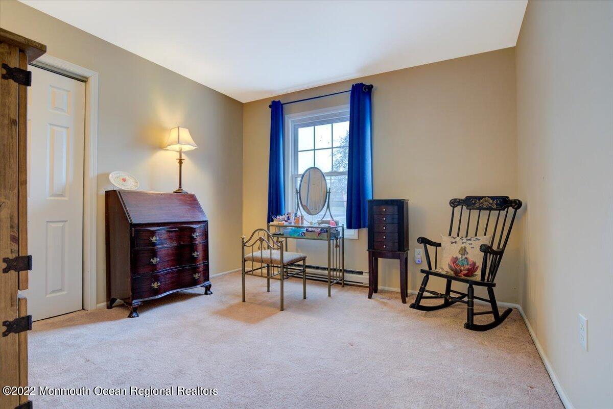 914 Monmouth Road Cream Ridge, NJ 08514 - Photo 7 of 17 a living room with furniture and a fireplace
