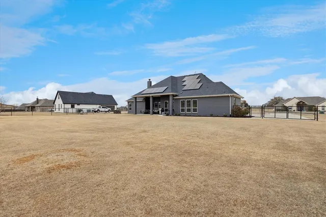 an aerial view of a house with outdoor space