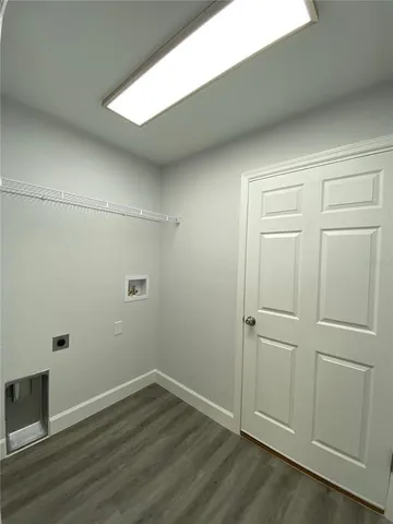 an empty room with wooden floor