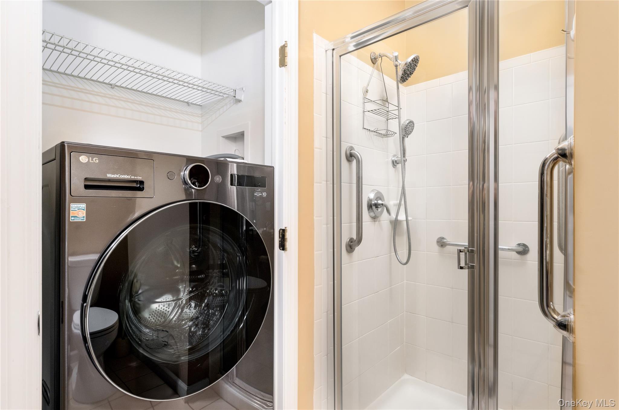 230 Ira Road, Unit 230 Mount Sinai, NY 11766 - Photo 13 of 38 a bathroom with a shower and mirror