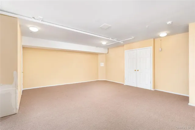 a view of a garden with sitting area