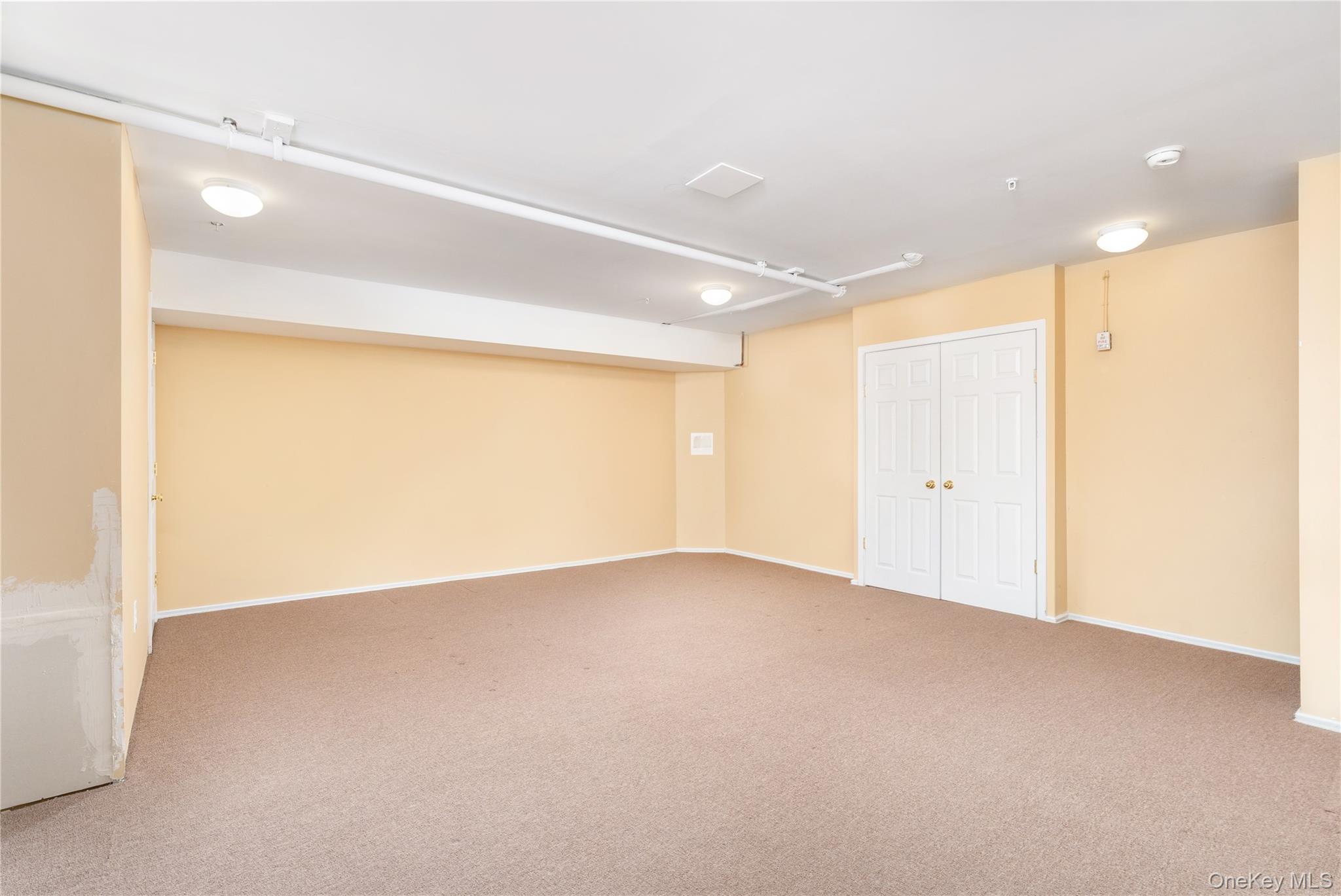 230 Ira Road, Unit 230 Mount Sinai, NY 11766 - Photo 21 of 38 a view of an empty room