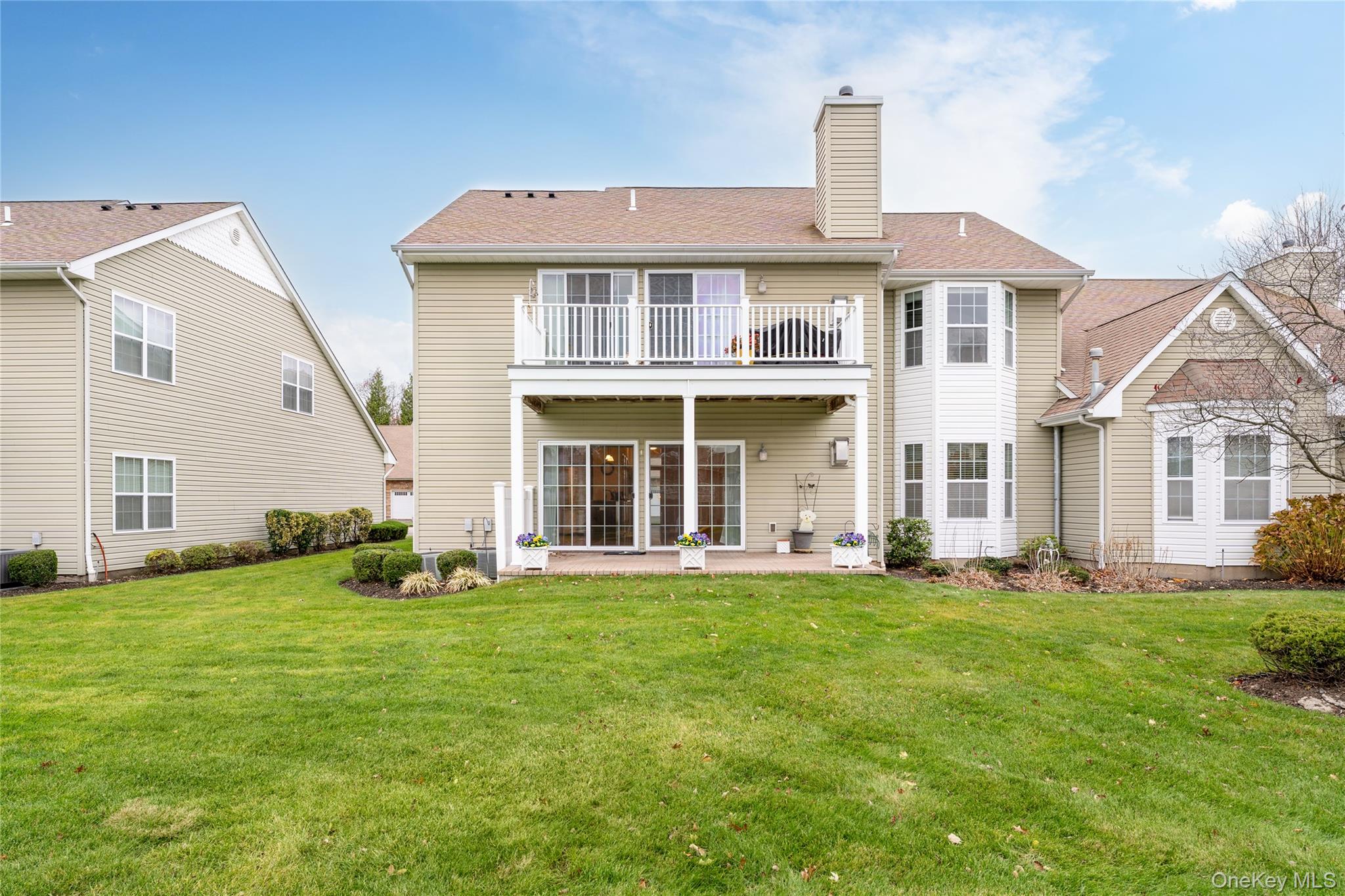 230 Ira Road, Unit 230 Mount Sinai, NY 11766 - Photo 26 of 38 front view of a house with a yard