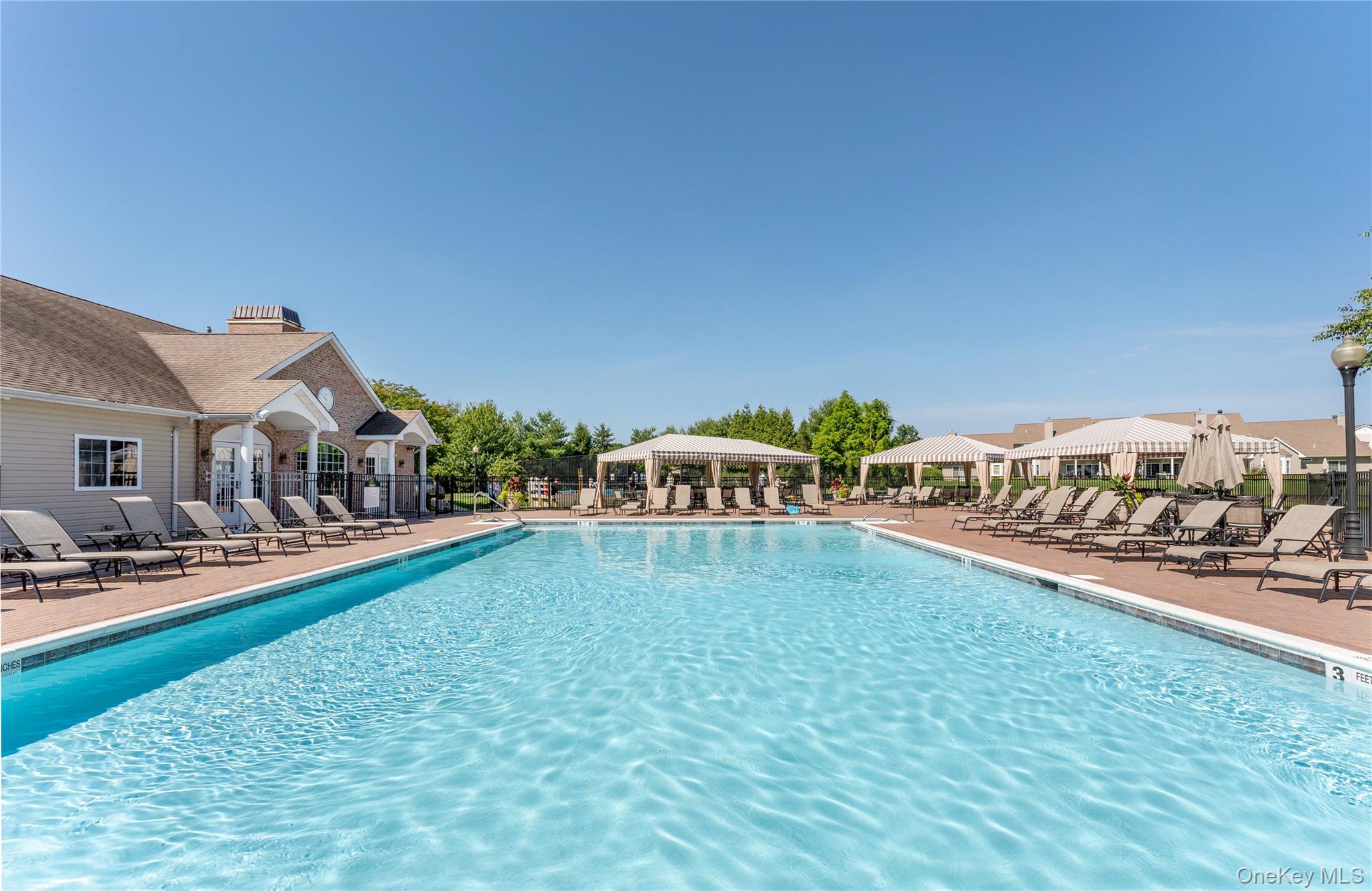 230 Ira Road, Unit 230 Mount Sinai, NY 11766 - Photo 28 of 38 a terrace with outdoor seating and city view