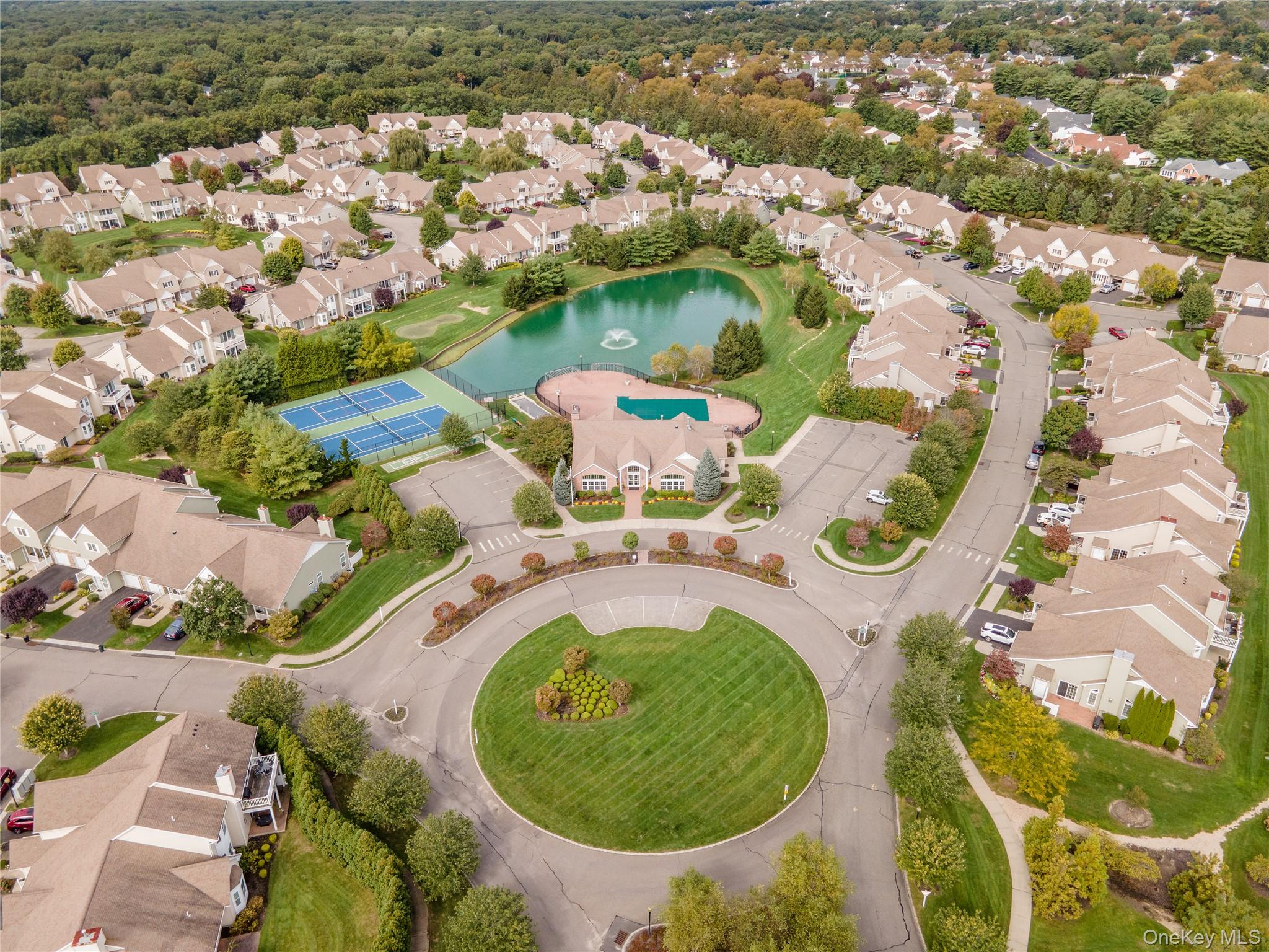 230 Ira Road, Unit 230 Mount Sinai, NY 11766 - Photo 34 of 38 an aerial view of residential house with outdoor space and swimming pool