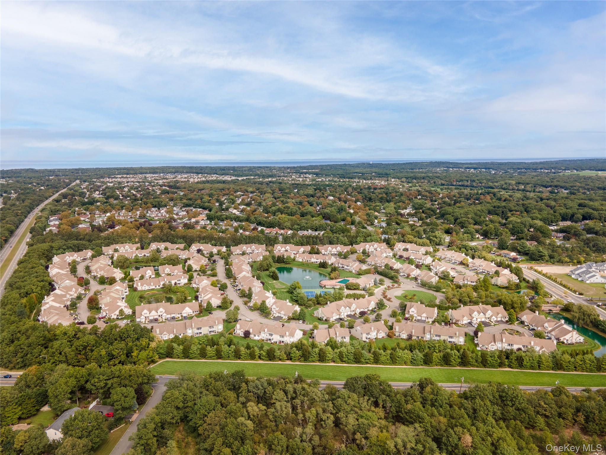230 Ira Road, Unit 230 Mount Sinai, NY 11766 - Photo 35 of 38 an aerial view of a city with lots of residential buildings