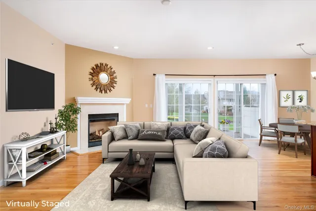 a large kitchen with kitchen island granite countertop wooden cabinets a granite counter tops and a window