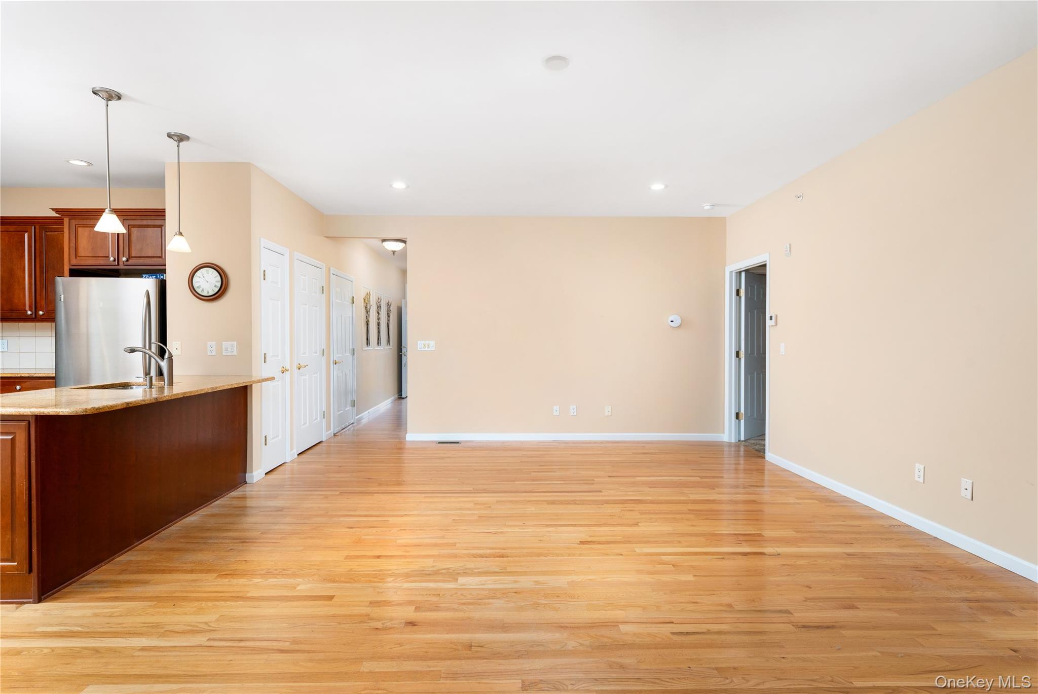 230 Ira Road, Unit 230 Mount Sinai, NY 11766 - Photo 38 of 38 a view of a kitchen with a sink and a refrigerator