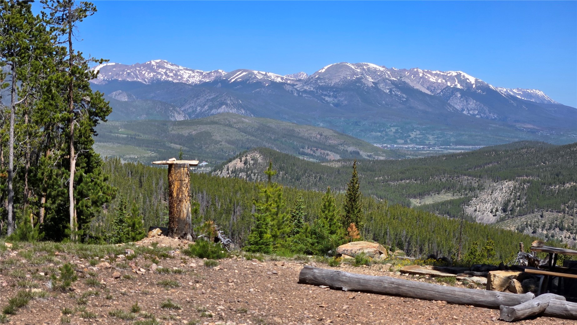 Tbd Summit Gulch Road Breckenridge, CO 80424 - Photo 2 of 30 a backyard of a house with a yard and mountain view in back