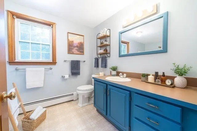 a bedroom with bed and a chandelier