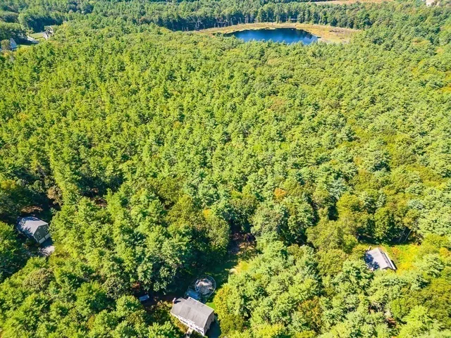 a swimming pool with yard in front of it