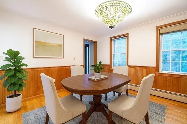 a kitchen with stainless steel appliances granite countertop wooden cabinets a refrigerator and a sink