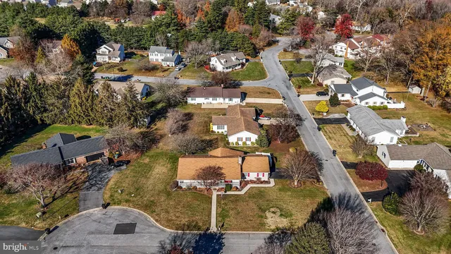 an aerial view of a house with outdoor space
