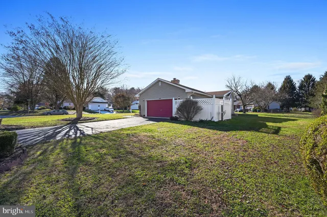 a view of a house with a yard and a swimming pool