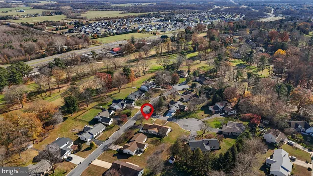 an aerial view of houses with outdoor space