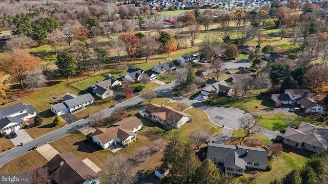 an aerial view of a house with outdoor space