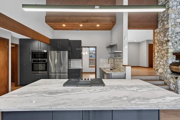 a kitchen with a wooden cabinets and outdoor space