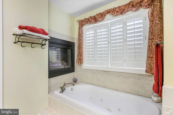 a kitchen with stainless steel appliances kitchen island granite countertop a sink and cabinets