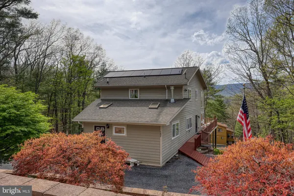 a view of a livingroom with furniture and window