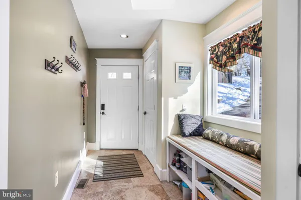 a living room with fireplace furniture and a fireplace