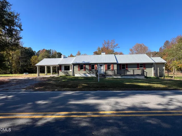 a view of a field with trees