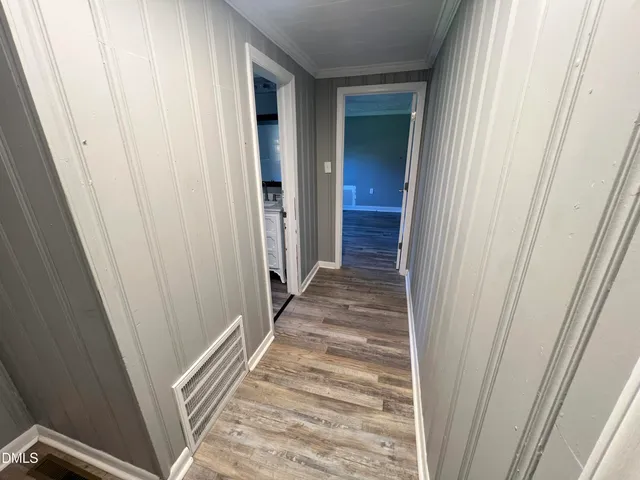 a view of entryway with wooden floor