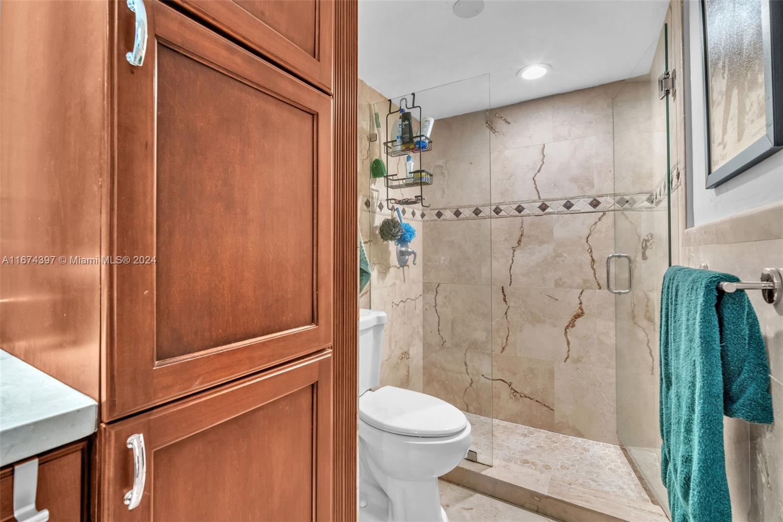 8335 Southwest 72nd Avenue, Unit 312D Miami, FL 33143 - Photo 11 of 45 a bathroom with a shower and a toilet