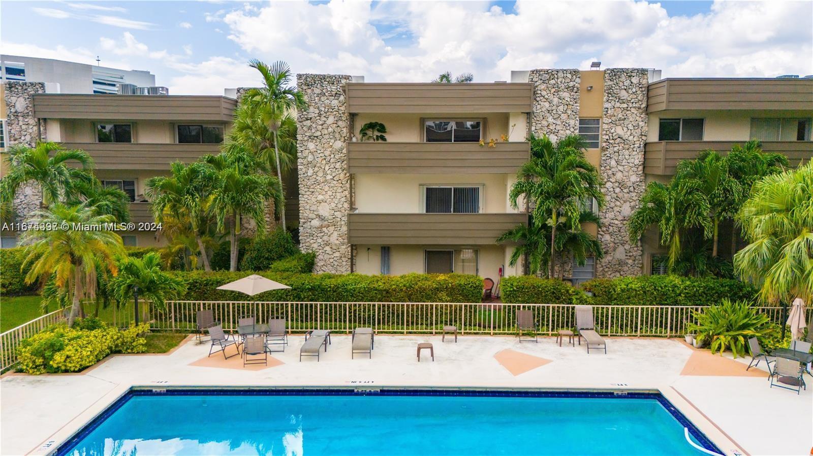 8335 Southwest 72nd Avenue, Unit 312D Miami, FL 33143 - Photo 23 of 45 a view of a swimming pool with a patio